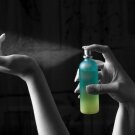 Perfume being sprayed on wrist